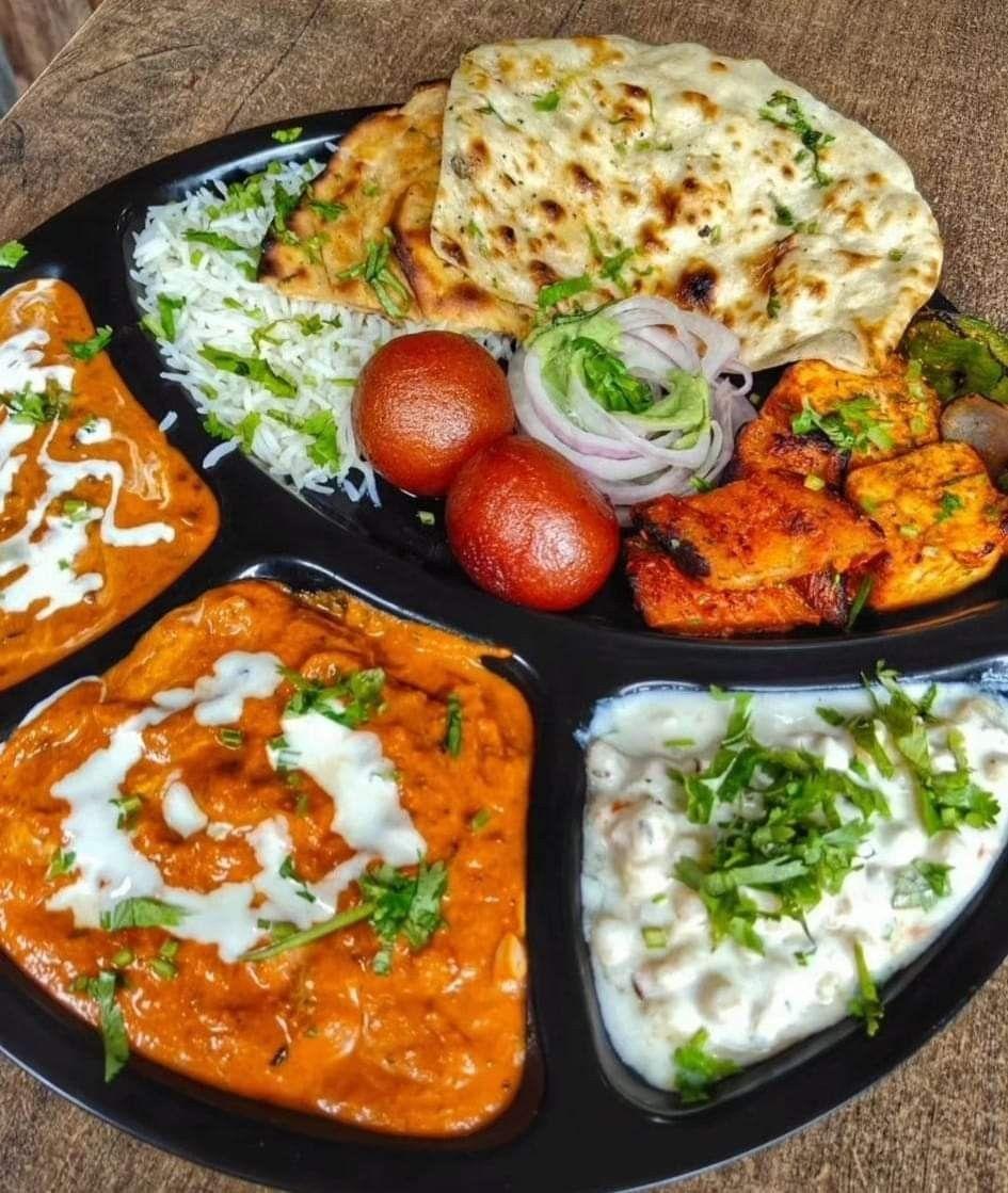 Any 3 Curries, Naan (4 pcs), Biryani, Vegetable Pakora, Raita, and Gulab Jamun (4 pcs)
